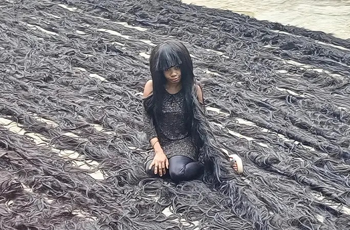Nigerian Woman Breaks Guinness World Record For Longest Handmade Wig