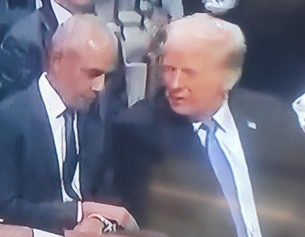 PHOTOS: Obama And Trump Chat At Carter's Funeral