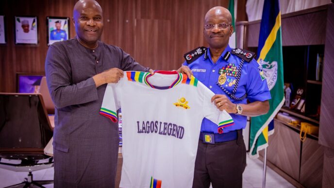 Engr Waidi Akanni (left) presenting a customised jersey of the Lagos Legends to the IGP Kayode Egbetokun during the courtesy visit to the IGP at the Force Headquarters in Abuja. recently